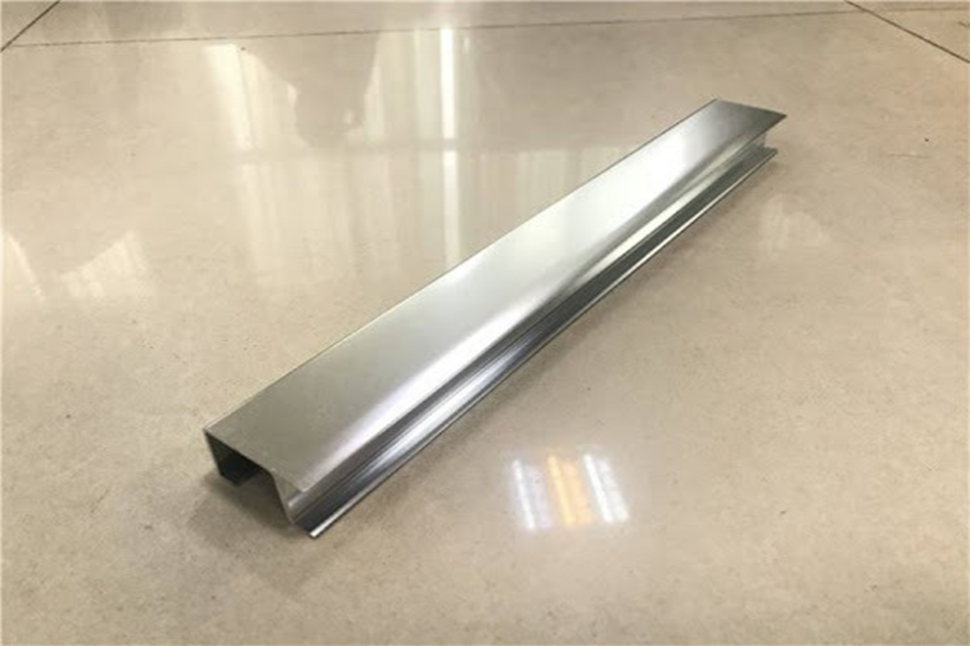 The aluminum metal surface after using abrasive sandpaper. 