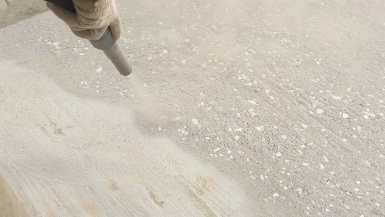 Sandblasting creates surface roughness on concrete. 